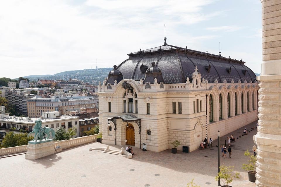 Budapest: Buda Castle Walking Tour & Folk Music Performance - Matthias Church and Fisherman’s Bastion: the postcard stop with context