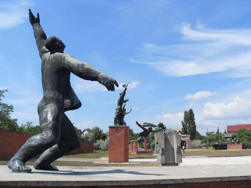 Budapest Half-Day Tour: Life Behind the Iron Curtain - Memento Park: propaganda statues moved out of daily life