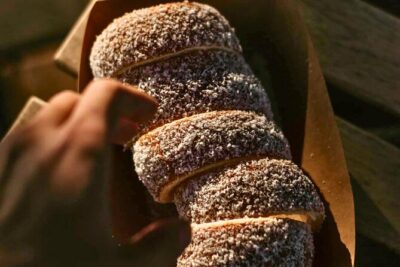 Chimney Cake Workshop Budapest Downtown - Kürtőskalács Class - Flavor rolling: cinnamon, coconut, and sugar choices that change the bite