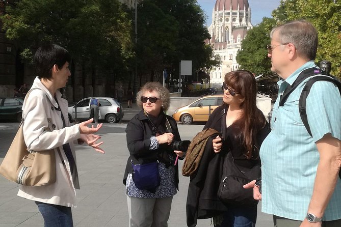 Communist Budapest Walking Tour - Stop 2: House of Terror outside view and the Berlin Wall slab
